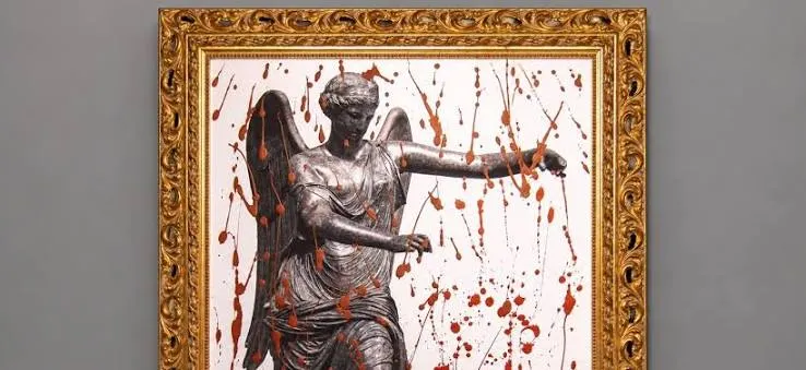 La Nike del bicentenario coperta dal sangue delle 56 guerre censite oggi